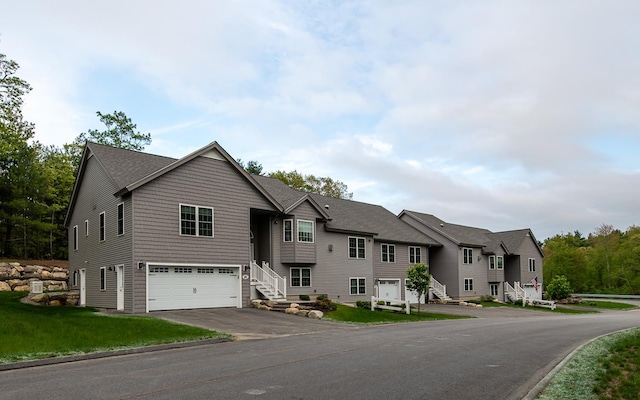 41 Winchester Dr, Hampstead, NH 03826 - view of front of property featuring asphalt driveway, a garage, and stairs