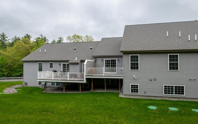 41 Winchester Dr, Hampstead, NH 03826 - back of property featuring a wooden deck, a yard, roof with shingles, and cooling unit