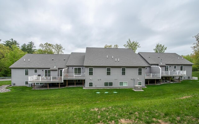 41 Winchester Dr, Hampstead, NH 03826 - rear view of property with a wooden deck, cooling unit, a lawn, and a shingled roof
