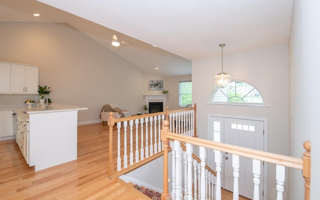 41 Winchester Dr, Hampstead, NH 03826 - entryway with light wood-type flooring, ceiling fan, recessed lighting, baseboards, and a glass covered fireplace