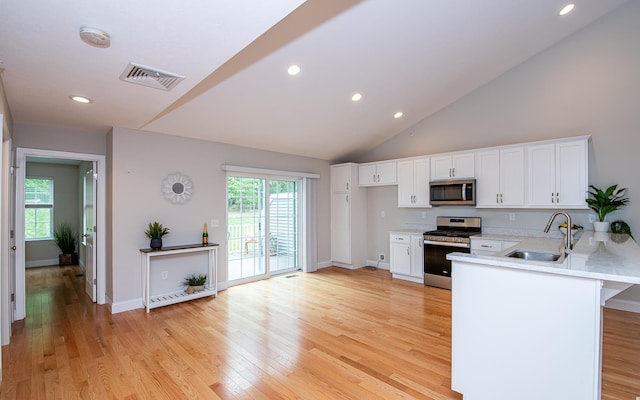 41 Winchester Dr, Hampstead, NH 03826 - kitchen with stainless steel appliances, a sink, white cabinetry, plenty of natural light, and recessed lighting