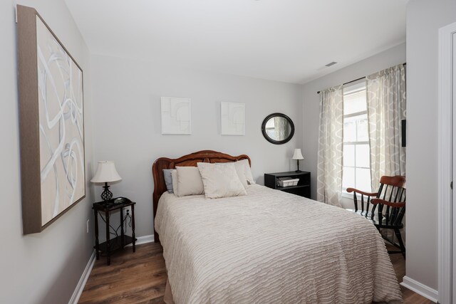 11 Sullivan Way Unit 6, Laconia, NH 03246 - bedroom featuring dark wood finished floors and baseboards