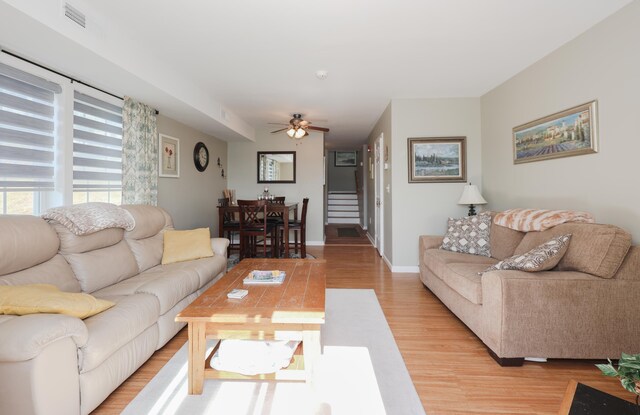 11 Sullivan Way Unit 6, Laconia, NH 03246 - living area with light wood-style flooring and ceiling fan