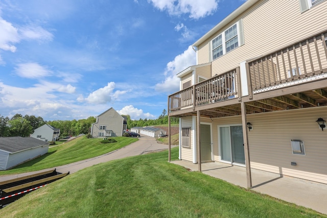 11 Sullivan Way Unit 6, Laconia, NH 03246 - view of green lawn with a patio and a wooden deck