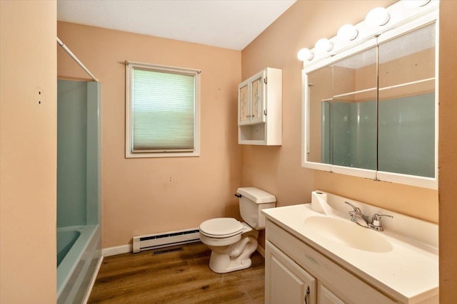 2099 W Shore Rd, Alburgh, VT 05440 - bathroom featuring a baseboard radiator, wood finished floors, toilet, vanity, and baseboards
