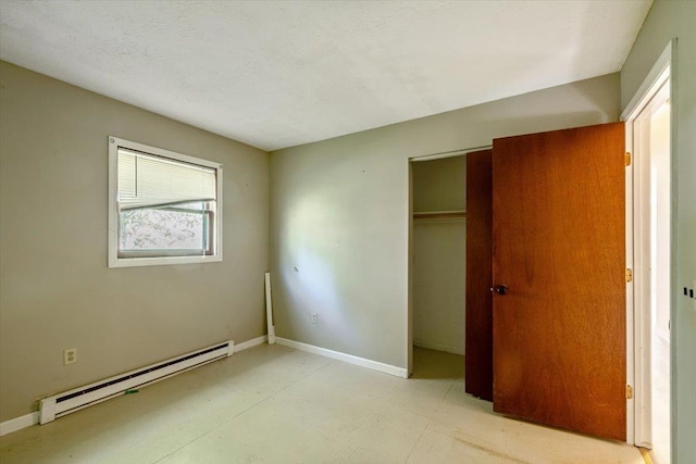 2099 W Shore Rd, Alburgh, VT 05440 - unfurnished bedroom with a baseboard heating unit, a closet, and baseboards