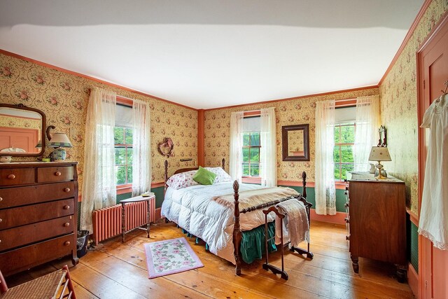 685 Abbot Hill Rd, Wilton, NH 03086 - bedroom featuring wallpapered walls, light wood-style flooring, multiple windows, and crown molding