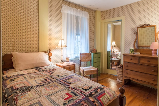 685 Abbot Hill Rd, Wilton, NH 03086 - bedroom featuring hardwood / wood-style flooring and wallpapered walls