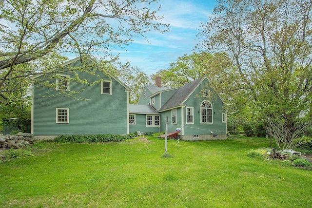 685 Abbot Hill Rd, Wilton, NH 03086 - rear view of house with a lawn and a chimney
