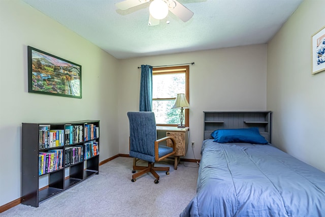 bedroom featuring carpet flooring, a ceiling fan, a textured ceiling, and baseboards