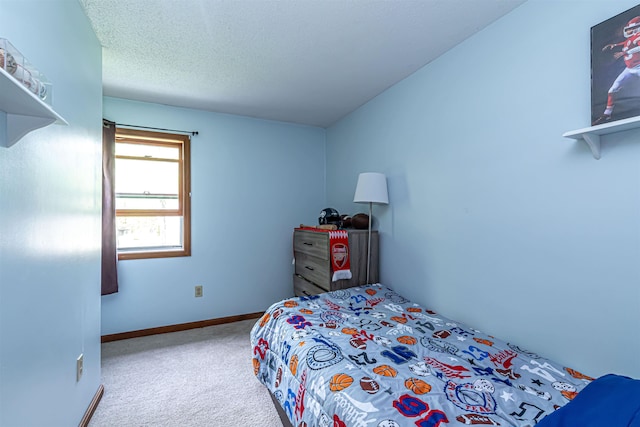 carpeted bedroom with baseboards