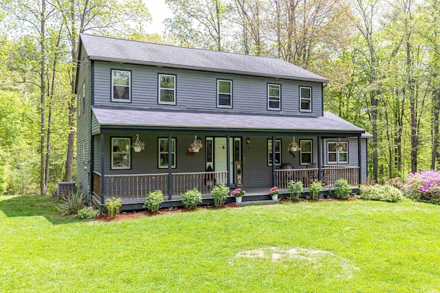 view of front facade with covered porch and a front lawn