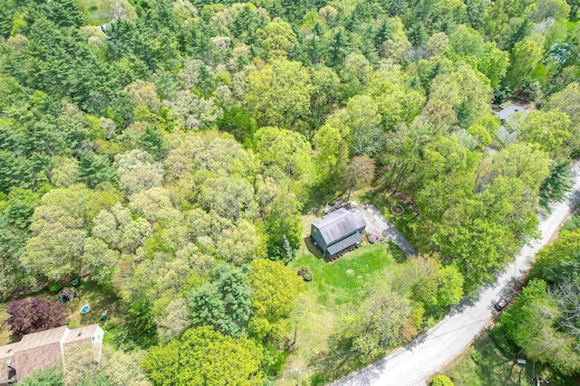 aerial overview of property's location featuring a heavily wooded area