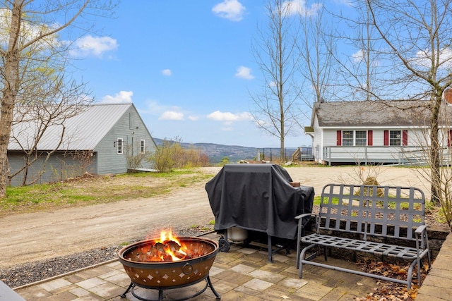 28 Lindsley Cir, Campton, NH 03223 - view of patio / terrace with a fire pit and a grill