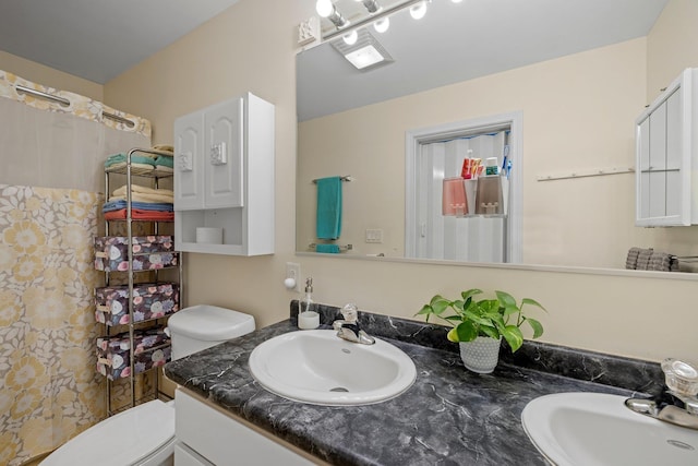28 Lindsley Cir, Campton, NH 03223 - bathroom featuring toilet and double vanity