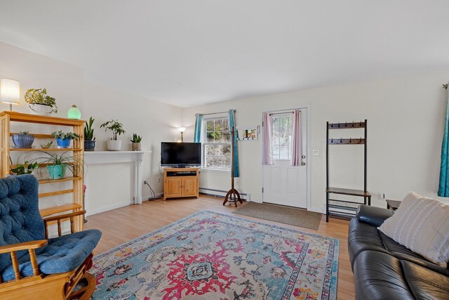 28 Lindsley Cir, Campton, NH 03223 - living area with light wood finished floors, a baseboard radiator, and baseboards