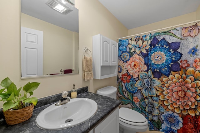 28 Lindsley Cir, Campton, NH 03223 - full bathroom with toilet, vanity, and a shower with shower curtain