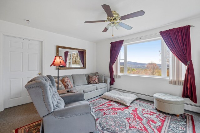 28 Lindsley Cir, Campton, NH 03223 - carpeted living room with a baseboard radiator and a ceiling fan