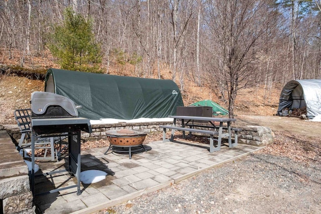 28 Lindsley Cir, Campton, NH 03223 - view of patio featuring an outdoor fire pit