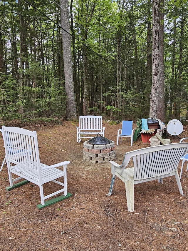 view of yard with a fire pit