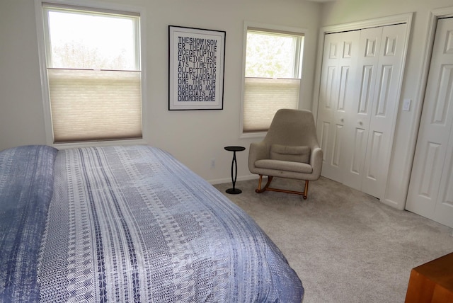 bedroom featuring carpet floors and baseboards