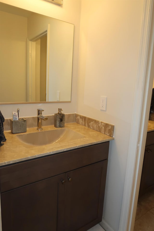 bathroom with vanity and tile patterned floors