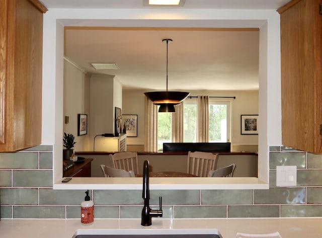 kitchen with a sink and backsplash