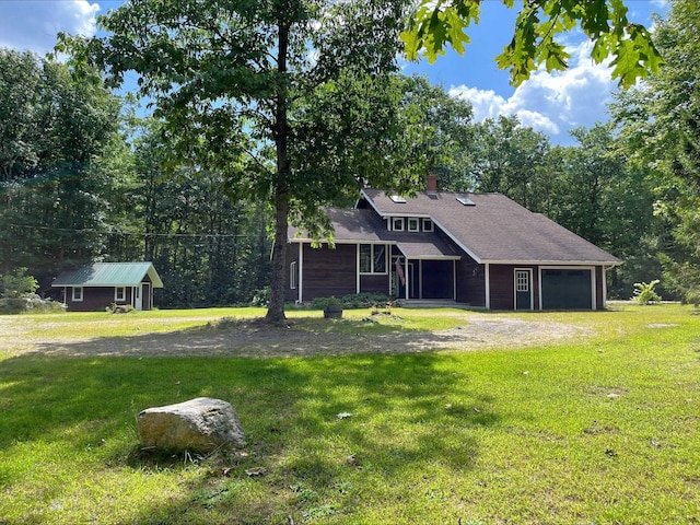 80 Mill St, Conway, NH 03813 - view of front facade with a front yard, a garage, and a chimney