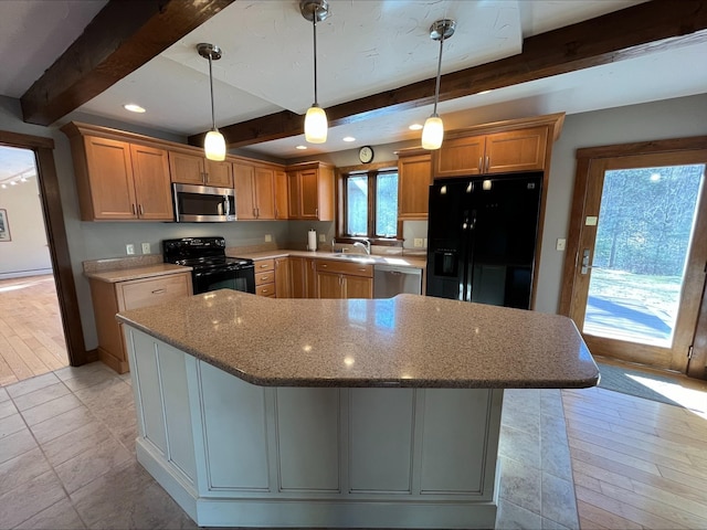 80 Mill St, Conway, NH 03813 - kitchen featuring black appliances, beamed ceiling, a sink, light stone counters, and a center island