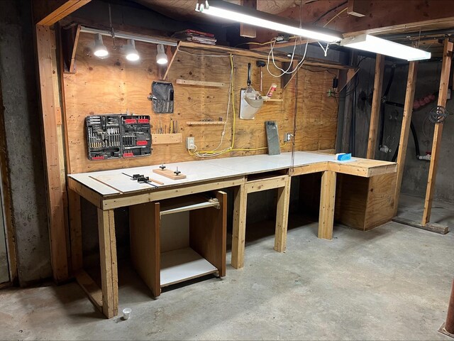 80 Mill St, Conway, NH 03813 - unfinished basement with a workshop area
