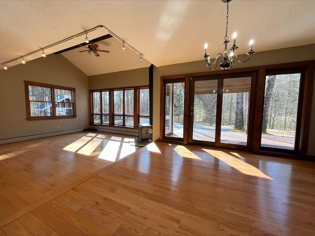 80 Mill St, Conway, NH 03813 - empty room with vaulted ceiling, track lighting, a chandelier, and plenty of natural light