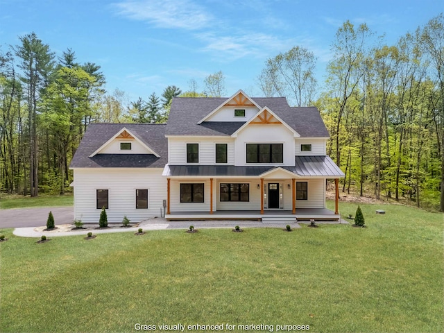 286 S Rd, Brentwood, NH 03833 - modern farmhouse style home with a standing seam roof, covered porch, a front yard, roof with shingles, and a metal roof