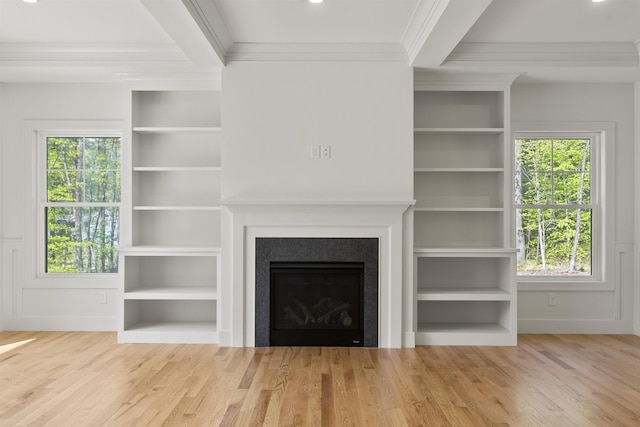 286 S Rd, Brentwood, NH 03833 - unfurnished living room featuring ornamental molding, wood finished floors, plenty of natural light, a fireplace, and built in shelves