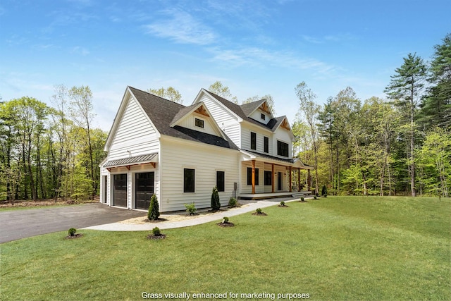 286 S Rd, Brentwood, NH 03833 - modern farmhouse featuring covered porch, a front yard, a garage, and driveway