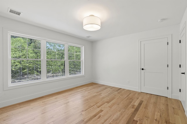 286 S Rd, Brentwood, NH 03833 - spare room with a smoke detector and light wood-style flooring