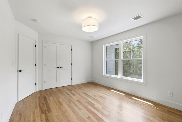 286 S Rd, Brentwood, NH 03833 - unfurnished bedroom featuring light wood-style floors and a closet