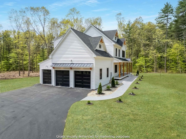 286 S Rd, Brentwood, NH 03833 - view of side of property featuring a lawn, roof with shingles, asphalt driveway, covered porch, and a standing seam roof