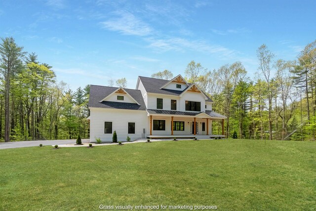 286 S Rd, Brentwood, NH 03833 - modern farmhouse with covered porch, a front lawn, a standing seam roof, and a metal roof