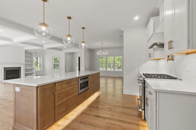 286 S Rd, Brentwood, NH 03833 - kitchen with stainless steel appliances, open floor plan, light wood finished floors, white cabinetry, and recessed lighting