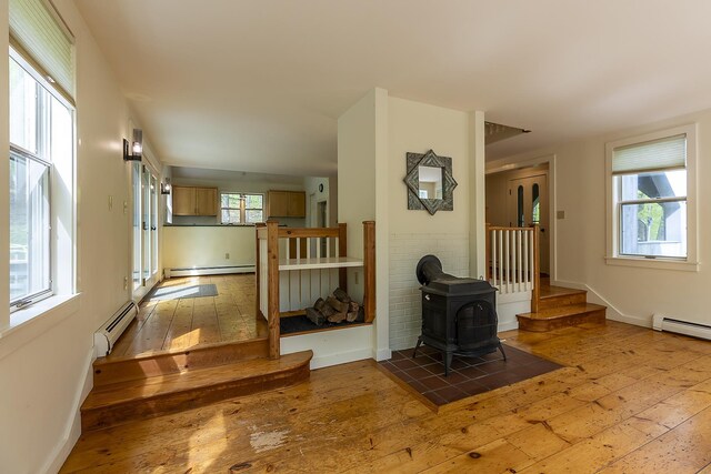 258 Densmore Hill Rd, Hartland, VT 05048 - living area with a baseboard radiator, hardwood / wood-style flooring, and stairway
