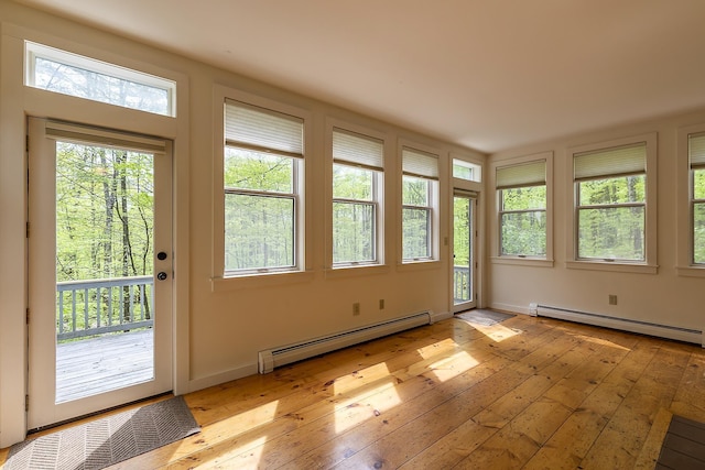 258 Densmore Hill Rd, Hartland, VT 05048 - unfurnished sunroom with a baseboard heating unit