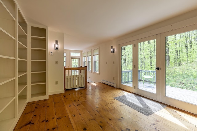 258 Densmore Hill Rd, Hartland, VT 05048 - doorway to outside with baseboard heating and wood-type flooring