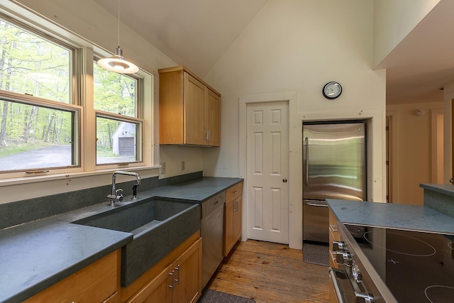 258 Densmore Hill Rd, Hartland, VT 05048 - kitchen featuring appliances with stainless steel finishes, wood-type flooring, a sink, dark countertops, and pendant lighting