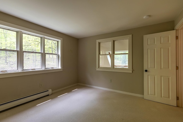 258 Densmore Hill Rd, Hartland, VT 05048 - unfurnished bedroom with a baseboard radiator, light carpet, and baseboards