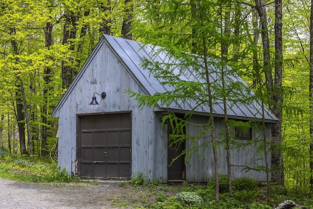258 Densmore Hill Rd, Hartland, VT 05048 - detached garage with driveway and a wooded view