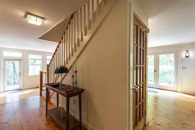 258 Densmore Hill Rd, Hartland, VT 05048 - staircase with wood-type flooring, baseboard heating, and baseboards