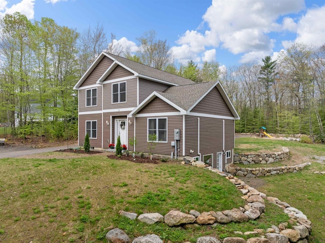 32 David Lewis Rd, Gilford, NH 03249 - view of front facade featuring a playground, a front yard, and a shingled roof