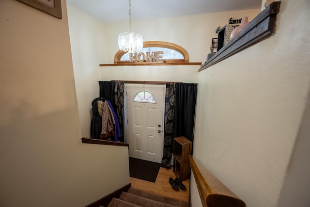 175 Blackwater Rd, Somersworth, NH 03878 - entryway featuring wood finished floors, a chandelier, and stairs