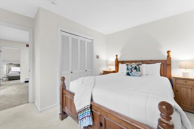 6 Roundtree Rd, Winhall, VT 05340 - bedroom with light carpet, a closet, and baseboards