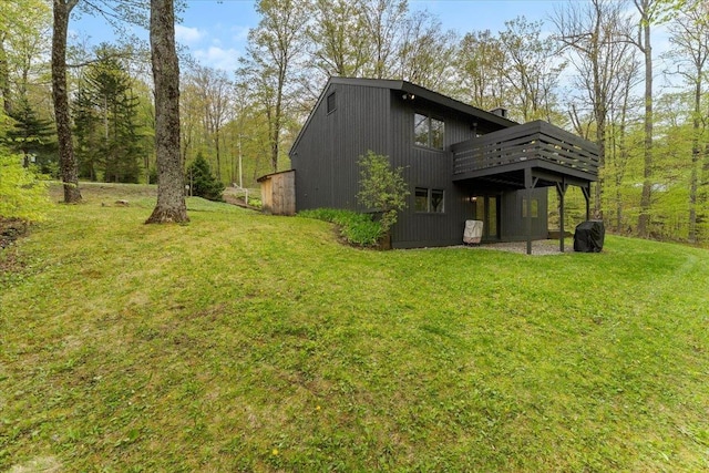 6 Roundtree Rd, Winhall, VT 05340 - rear view of house with a yard and a wooden deck